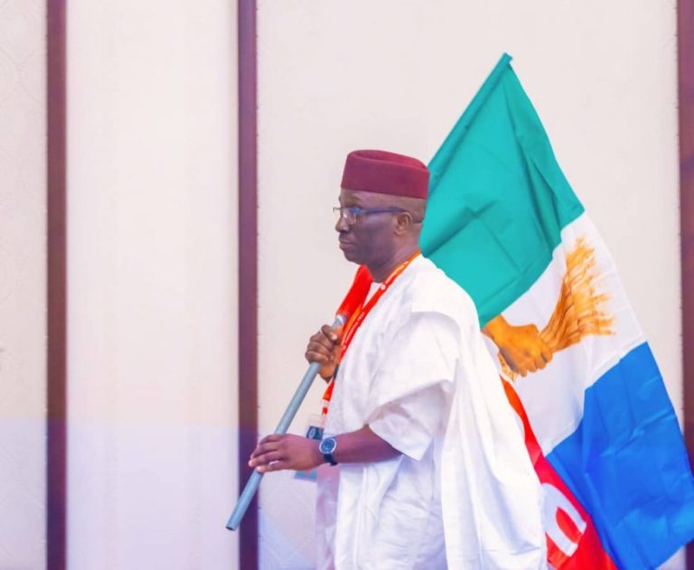 Monday-Okpebholo-with-the-APC-flag-876x720.jpg